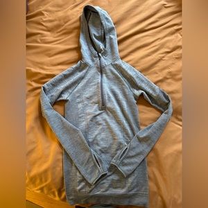 Lululemon Size 4 Half Zip Long Sleeved Athletic Shirt with Thumb Holes.